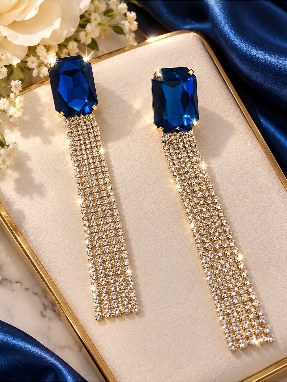 Elegant Gold Drop Earrings with Deep Blue Crystal